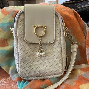 Elegant Cream Crossbody Bag with Gold Accents